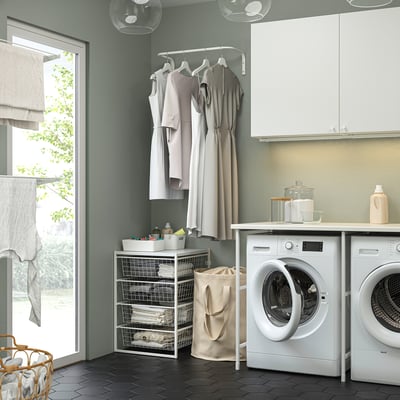 Laundry room with white appliances and JONAXEL storage.