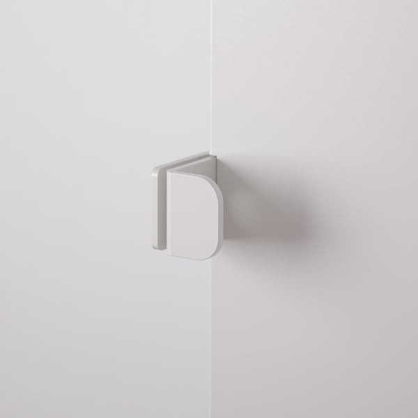 White metal door hinge mounted on wall corner, minimalist design.