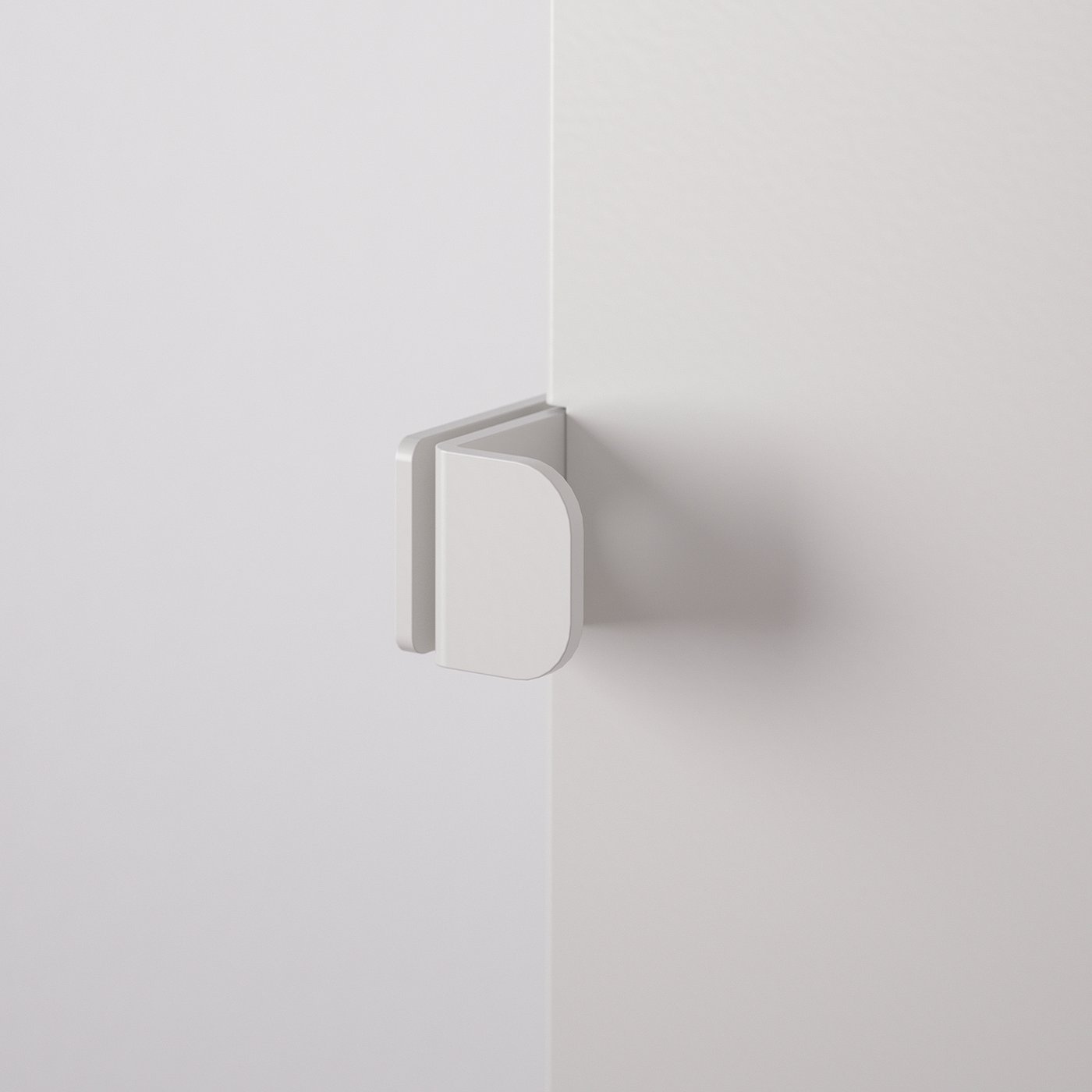 White metal door hinge mounted on wall corner, minimalist design.