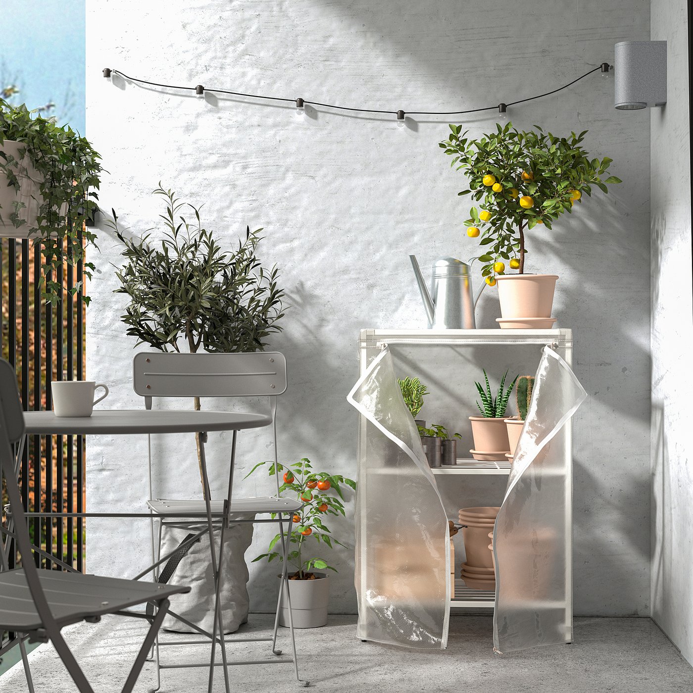 Balcony with JOSTEIN storage, plants, and string lights.