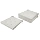 Two light grey rectangular chair cushions, one folded, one lying flat, with tufted designs and loop fasteners.