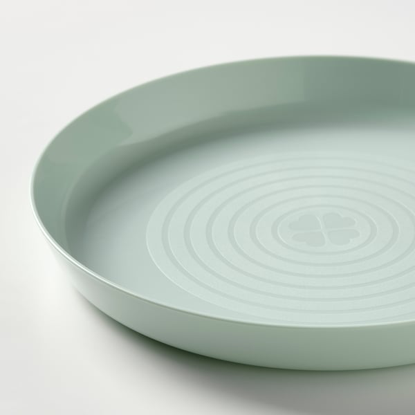 Light green kids plate, smooth and glossy surface, high edges, well-made and colourful.