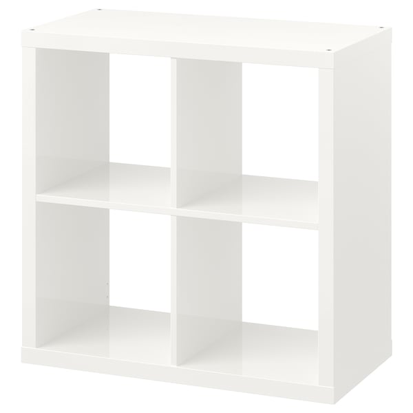 White KALLAX cube shelf, minimalist design, wooden material, stands or wall mounts.