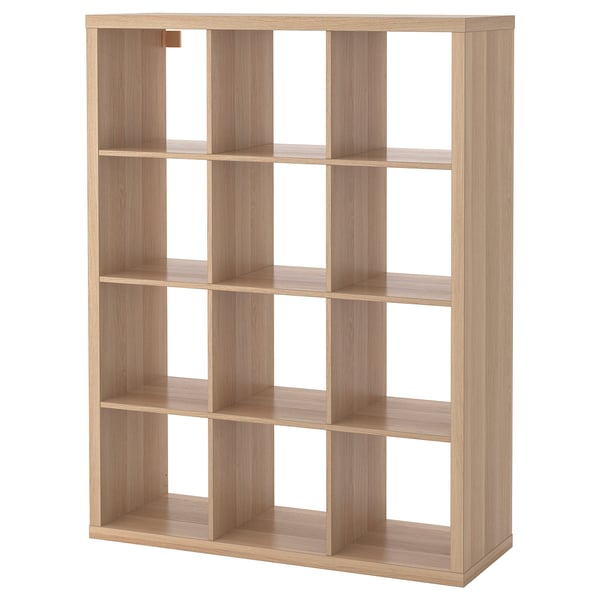 KALLAX light brown wooden cube shelf, empty, four rows, four cubes per row.