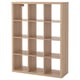 KALLAX light brown wooden cube shelf, empty, four rows, four cubes per row.