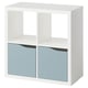 A white KALLAX shelf unit with two blue drawers. It a modern design with a square shape. The drawers have reflective doors.