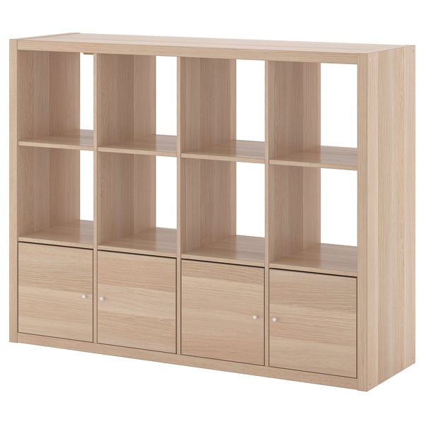 The ikea KALLAX is a light wooden shelf unit with an oak finish, featuring six open compartments and three drawers.