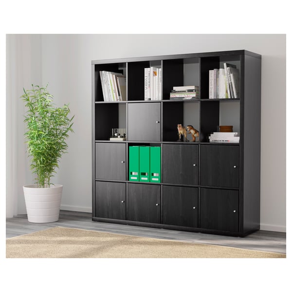 Black storage unit with mix of open shelves and closed cabinets. Holds books, decor, and hides files.