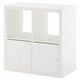 A white KALLAX storage unit with two compartments, one with doors. Modern and minimalist design for organizing small spaces.