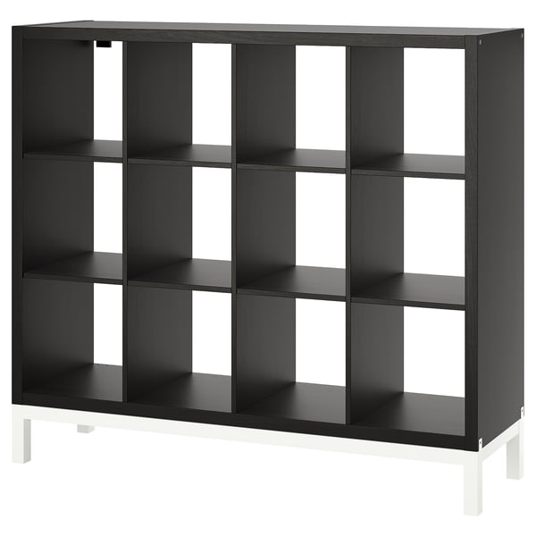 Black KALLAX shelving unit with white legs, modern design and open compartments.