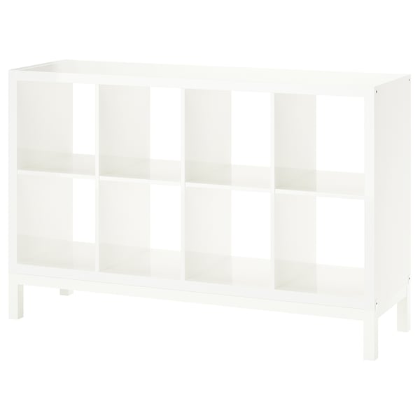 A white KALLAX shelving unit with multiple open cubes, supported by an underframe for an airy look, ideal for storage and display.