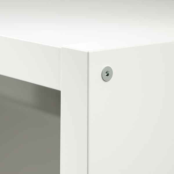 Close-up of a well-made, white corner of a tv unit; slight reflection on smooth surface.