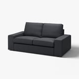 KIVIK charcoal couch: modern, boxy, plush upholstery, minimalistic.