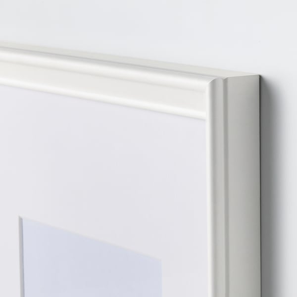 Close-up of a white picture frame, showcasing its sleek design and sturdy construction.