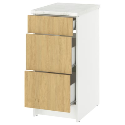 KNOXHULT white and oak kitchen unit with three drawers and marble worktop.