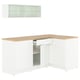 Displays a KNOXHULT white corner kitchen unit with oak effect top, featuring drawers, cabinets, and a wall cabinet with glass doors.
