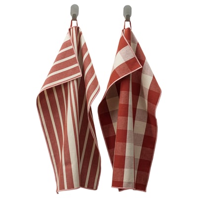 Two red striped kitchen towels hang on hooks. Made from cotton and jute, featuring classic patterns and loops for hanging.