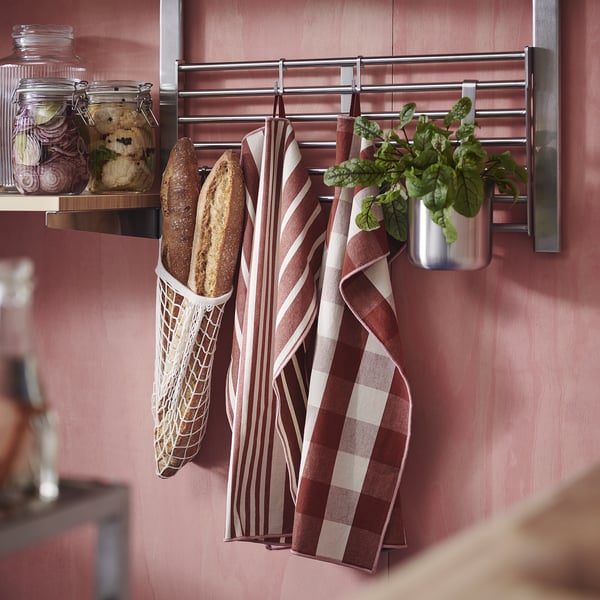 KÖSSEBÄR red/brown towels hang beside bread, jars.