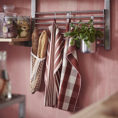 KÖSSEBÄR red/brown towels hang beside bread, jars.