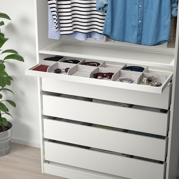 White wardrobe organiser with drawers and compartments for accessories, keeping items neat and accessible.