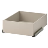 The KOMPLEMENT drawer in beige with a soft-close mechanism for organising clothes or accessories.