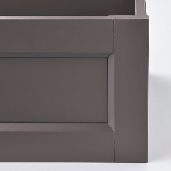 Drawer detail: modern, dark finish, sleek lines, high-quality materials.