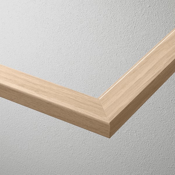 A close-up of a bevelled edge glass shelf, set against a plain wall. It appears sturdy, with a sleek, modern design.