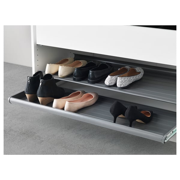 KOMPLEMENT metal shoe shelf with alternating levels.