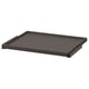 A black rectangular KOMPLEMENT pull-out tray with a smooth surface, designed for easy storage in wardrobes.