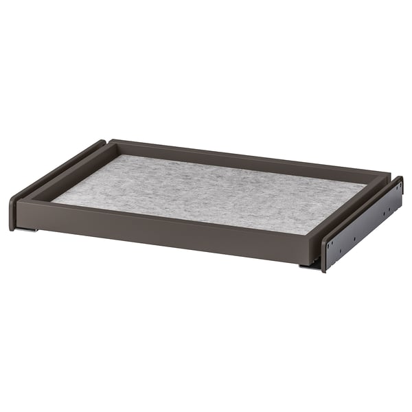 A KOMPLEMENT pull-out tray, dark grey, with a felt mat. Its rectangular and designed for wardrobe storage.