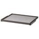 A grey KOMPLEMENT pull-out tray for storage, surrounded by a brown frame with a soft, silicone dot felt liner.