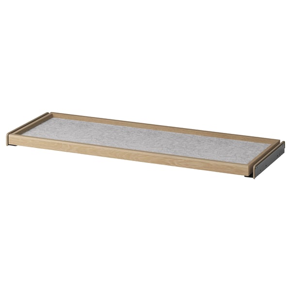 Wooden pull-out tray with natural finish and grey mat, ideal for wardrobe storage.