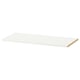 A white KOMPLEMENT shelf from IKEA, rectangular in shape with a smooth finish.