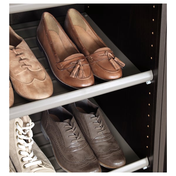 Shoe shelf holds four pairs of shoes, keeping them organised and easily accessible.