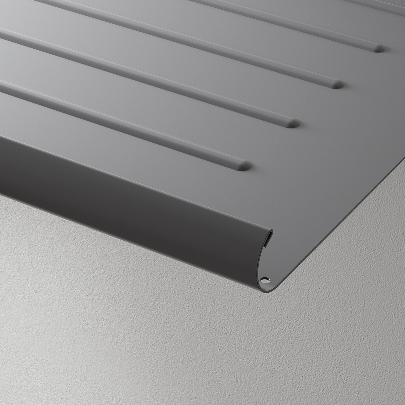 Modern, metallic grey shelf with slanted design and chamfered edge, perfectly displayed against a clean wall.