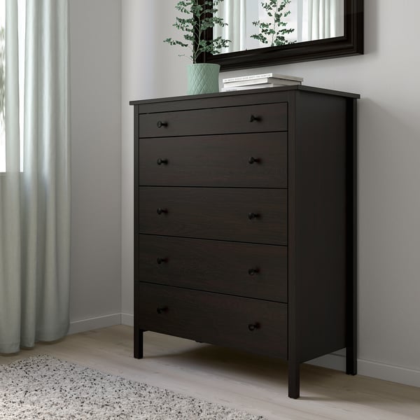 KOPPANG chest in black, fits well in bedroom corner, dark brown, five drawers, large, upstairs mirror, plant, books on top.