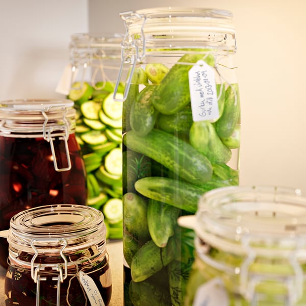 Jars with pickles and jams, sealed to lock in freshness.