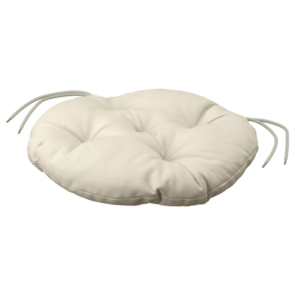 An off-white circular KUDDARNA cushion with ties for securing. Made from polyester, its ideal for outdoor use with sustainable, fade-resistant fabric.