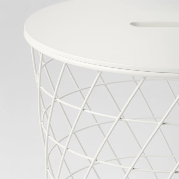 Round white storage table with intricate, diamond-patterned metal base, sturdy and stylish.