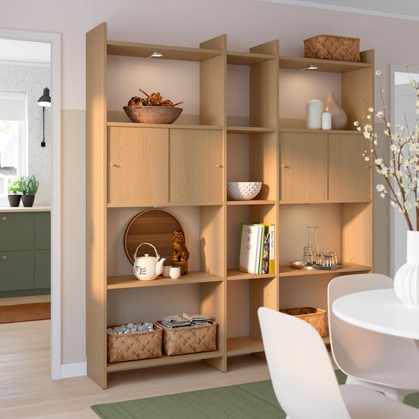 LÅDMAKARE light wood shelving unit with open & closed sections. Displays various home decor in a neat, organised manner.