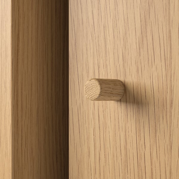 Close-up of wooden cabinet with LÅDMAKARE handle. High-quality light wood design, sleek finish, and crafted for durability.