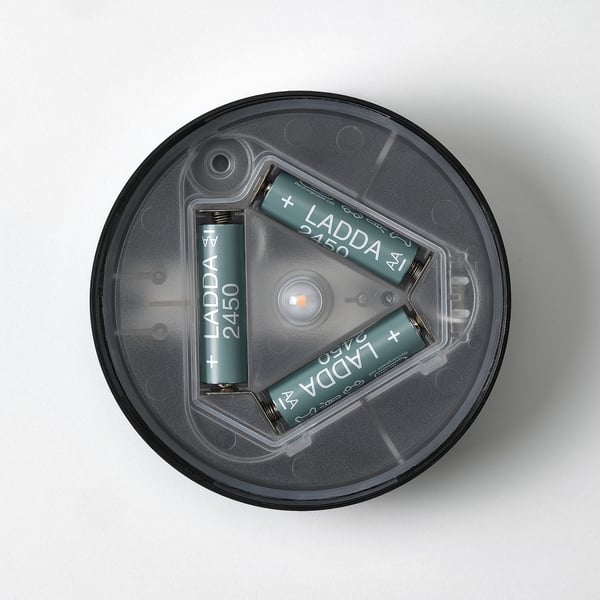 Led lamp with two rechargeable batteries in holder.