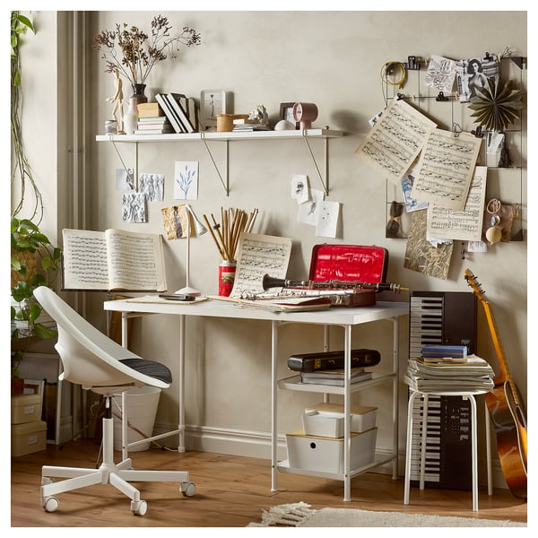 Ikea LAGKAPTEN desk with colorful grid, storage, and musical instruments.