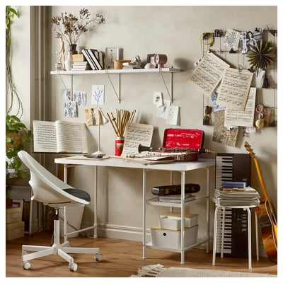 Ikea LAGKAPTEN desk with colorful grid, storage, and musical instruments.