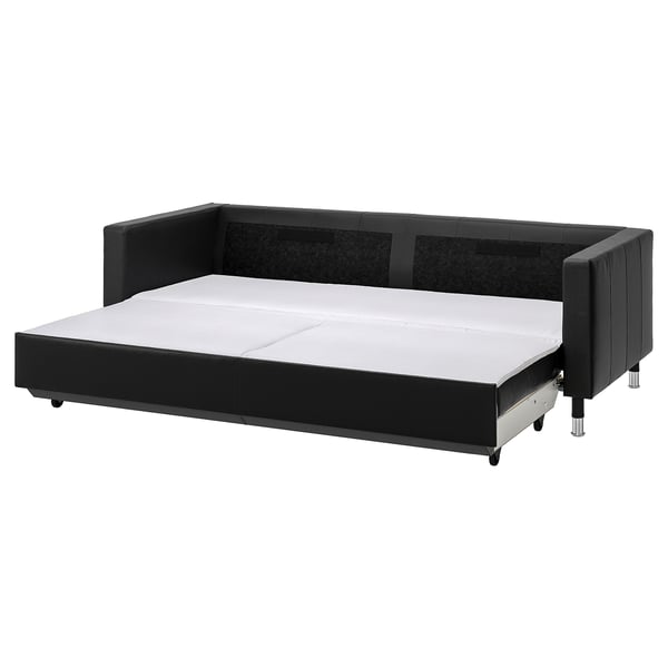 Black leather sofa-bed with storage, chrome legs, plush cushions.