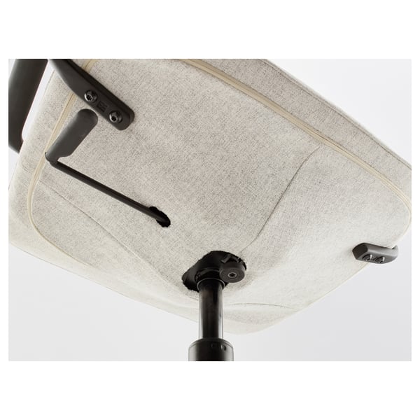 A close-up of an office chairs seat and controls, highlighting durable fabric and sturdy metal mechanisms.
