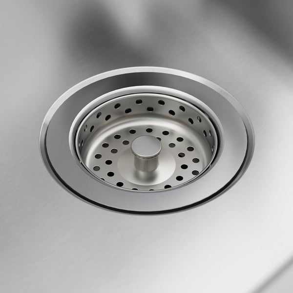 Stainless steel sink strainer, clean, modern, with multiple drain holes.