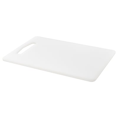 White plastic chopping board with handle. Simple design, rectangular shape. Ideal for food preparation.