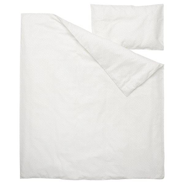 White baby bedding set: duvet & pillow with subtle dot pattern, soft sustainably sourced cotton.