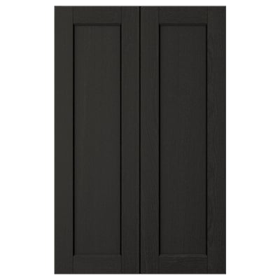 Black LERHYTTAN kitchen cabinet doors feature solid wood with bevelled edges and ash veneer panels, displaying a timeless, rustic design.
